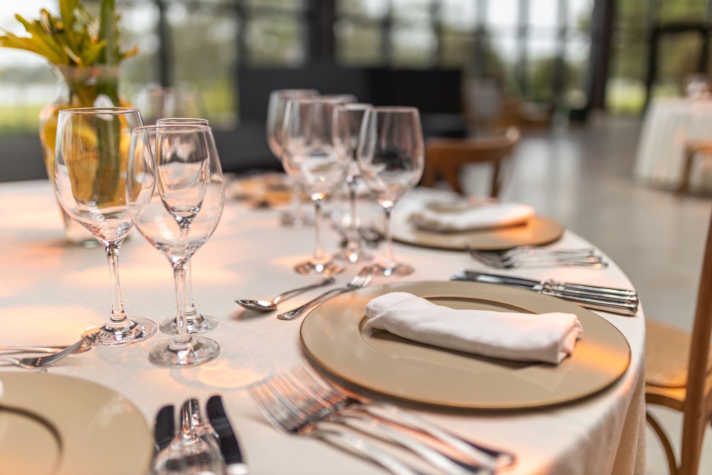 A table laid with wine glasses before service